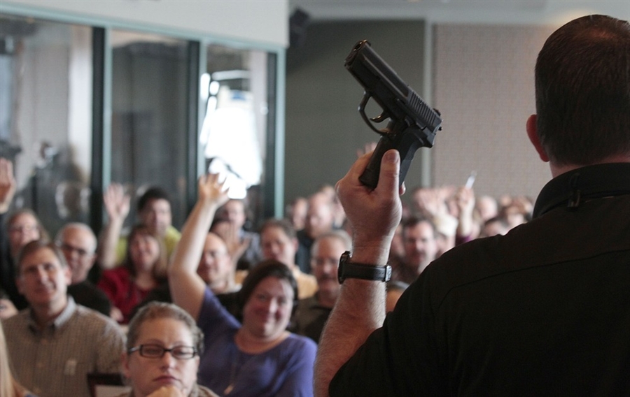 Classroom teacher talking about firearm safety