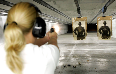 Woman practicing target shooting at the 